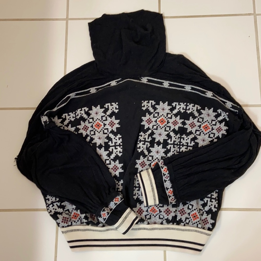 Free people size large embroidered pull over with banded waist and sleeves
